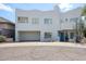 Contemporary two-story home with a striking white exterior, two-car garage and drought-tolerant landscaping at 1731 E Evans Dr, Phoenix, AZ 85022