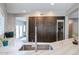 Stylish kitchen featuring stone countertops, stainless steel appliances, and a built-in wine refrigerator at 1731 E Evans Dr, Phoenix, AZ 85022