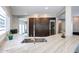 Stylish kitchen featuring stone countertops, stainless steel appliances, and a built-in wine refrigerator at 1731 E Evans Dr, Phoenix, AZ 85022
