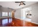Spacious living room with hardwood floors adjacent to kitchen featuring sleek, modern cabinetry at 1731 E Evans Dr, Phoenix, AZ 85022