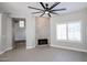 Bright living room featuring a decorative fireplace, large windows, and tile flooring for a modern look at 1731 E Evans Dr, Phoenix, AZ 85022