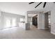 Spacious open-concept living room with tiled flooring, a large island, and abundant natural light at 1731 E Evans Dr, Phoenix, AZ 85022
