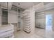 Spacious walk-in closet with shelving, drawers, and mirrored wall, providing ample storage and organization options at 1731 E Evans Dr, Phoenix, AZ 85022