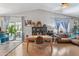 Bright dining room with wood floors, views to the backyard and open living room at 1822 N Sunaire Cir, Mesa, AZ 85205