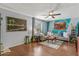 Comfortable living room with modern decor, cozy seating, and a ceiling fan at 1822 N Sunaire Cir, Mesa, AZ 85205