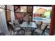 Charming patio featuring a seating area with outdoor dining with nearby pool at 1822 N Sunaire Cir, Mesa, AZ 85205