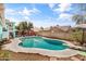 Inviting backyard pool with diving board, pergola, landscaping, and ample space for relaxation and enjoyment at 1822 N Sunaire Cir, Mesa, AZ 85205