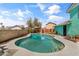 Backyard pool with unique design, surrounded by privacy wall and landscaping at 1822 N Sunaire Cir, Mesa, AZ 85205