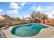 Sparkling in-ground pool in a private backyard setting with beautiful blue skies at 1822 N Sunaire Cir, Mesa, AZ 85205