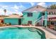 Backyard pool featuring a diving board, patio, landscaping, and home access at 1822 N Sunaire Cir, Mesa, AZ 85205