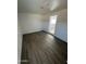 Neutral bedroom with hard wood floors and white walls provides a blank canvas for decor at 2027 E Michelle Dr, Phoenix, AZ 85022