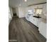 Spacious, renovated kitchen with white cabinets, ample counter space, and modern appliances at 2027 E Michelle Dr, Phoenix, AZ 85022