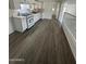 Bright, updated kitchen with white cabinets, marble-look countertops, and new appliances at 2027 E Michelle Dr, Phoenix, AZ 85022