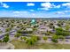 Scenic aerial view of the neighborhood showcasing manicured lawns and mature trees at 2069 S Sailors Ct, Gilbert, AZ 85295