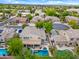 Expansive aerial view of a two-story home, featuring a backyard pool and spa at 2069 S Sailors Ct, Gilbert, AZ 85295