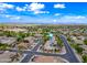 Gorgeous aerial view of the neighborhood, a community pool, and well-maintained streets at 2069 S Sailors Ct, Gilbert, AZ 85295