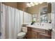 Neutral bathroom with a single sink vanity and a shower tub combination at 2069 S Sailors Ct, Gilbert, AZ 85295
