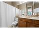 Cozy bathroom with a neutral color scheme, a shower/tub combo, and a single sink vanity at 2069 S Sailors Ct, Gilbert, AZ 85295