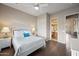 Bright bedroom with hardwood floors, closet space and en-suite bathroom access at 2069 S Sailors Ct, Gilbert, AZ 85295