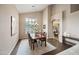 Formal dining room with hardwood floors, chandelier, and lots of natural light at 2069 S Sailors Ct, Gilbert, AZ 85295
