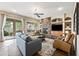 Inviting living room with a stone fireplace and seamless access to the outdoor space at 2069 S Sailors Ct, Gilbert, AZ 85295