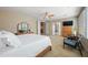 Spacious main bedroom with a ceiling fan, with views of the stairway and closet at 2069 S Sailors Ct, Gilbert, AZ 85295
