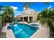 Backyard oasis with a sparkling pool, hot tub, and patio area for outdoor entertaining at 2069 S Sailors Ct, Gilbert, AZ 85295