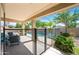 Covered back patio overlooks a pool with mature landscaping, offering privacy and a resort-like atmosphere at 2069 S Sailors Ct, Gilbert, AZ 85295
