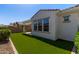 Exterior view showcasing the home's well-maintained backyard and patio space at 20698 W Meadowbrook Ave, Buckeye, AZ 85396
