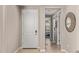 Bright entryway with wood-look tile flooring and access to a 'Bath' and what appears to be a bedroom at 20698 W Meadowbrook Ave, Buckeye, AZ 85396