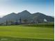 Picturesque golf course with a mountain backdrop, showcasing well-maintained greens and desert landscape at 20698 W Meadowbrook Ave, Buckeye, AZ 85396