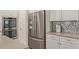 Close-up of stainless steel fridge and double oven in a modern kitchen at 20698 W Meadowbrook Ave, Buckeye, AZ 85396