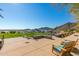 Outdoor lounge area with Adirondack chairs and beautiful views of the surrounding mountains and landscape at 20698 W Meadowbrook Ave, Buckeye, AZ 85396