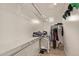 Spacious walk-in closet with ample shelving and hanging space for organized storage at 20698 W Meadowbrook Ave, Buckeye, AZ 85396