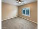 Neutral bedroom with plush carpet, large window, and ample natural light at 2088 N 164Th Ave, Goodyear, AZ 85395