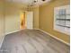 Neutral bedroom with carpeting, a window with shutters, and an open doorway at 2088 N 164Th Ave, Goodyear, AZ 85395