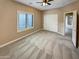 Cozy bedroom features neutral carpet, shuttered windows, and a closet at 2088 N 164Th Ave, Goodyear, AZ 85395