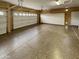 Spacious two-car garage with epoxy flooring and ample storage cabinets at 2088 N 164Th Ave, Goodyear, AZ 85395