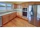 Well-equipped kitchen with stainless steel appliances, light wood cabinets and ample counter space at 2088 N 164Th Ave, Goodyear, AZ 85395