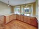 Open concept kitchen with an cooktop island and slider doors to the outside living spaces at 2088 N 164Th Ave, Goodyear, AZ 85395