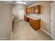 Functional laundry room with ample counter space and built-in cabinets at 2088 N 164Th Ave, Goodyear, AZ 85395