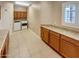Bright laundry room with washer, dryer, window and built-in storage cabinets at 2088 N 164Th Ave, Goodyear, AZ 85395