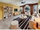 Bright living room featuring large windows, contemporary furniture, and stylish striped rug at 2088 N 164Th Ave, Goodyear, AZ 85395