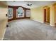 Spacious living room with neutral carpet, ceiling fan, and large windows providing natural light at 2088 N 164Th Ave, Goodyear, AZ 85395