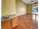 Open living space with hardwood floors, a wet bar, and sliding glass doors to outdoor area at 2088 N 164Th Ave, Goodyear, AZ 85395