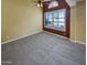 Bright and spacious living room featuring neutral carpet, large windows, and versatile layout at 2088 N 164Th Ave, Goodyear, AZ 85395