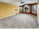 Spacious living room with neutral carpet, large windows, and ample natural light at 2088 N 164Th Ave, Goodyear, AZ 85395