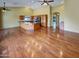 Bright living space featuring a gourmet kitchen, hardwood floors, ceiling fans and a large island at 2088 N 164Th Ave, Goodyear, AZ 85395