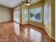 Bright living space with hardwood floors, plantation shutters, and a sliding glass door at 2088 N 164Th Ave, Goodyear, AZ 85395