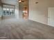Spacious main bedroom features large windows, neutral carpet and adjoined ensuite bathroom at 2088 N 164Th Ave, Goodyear, AZ 85395